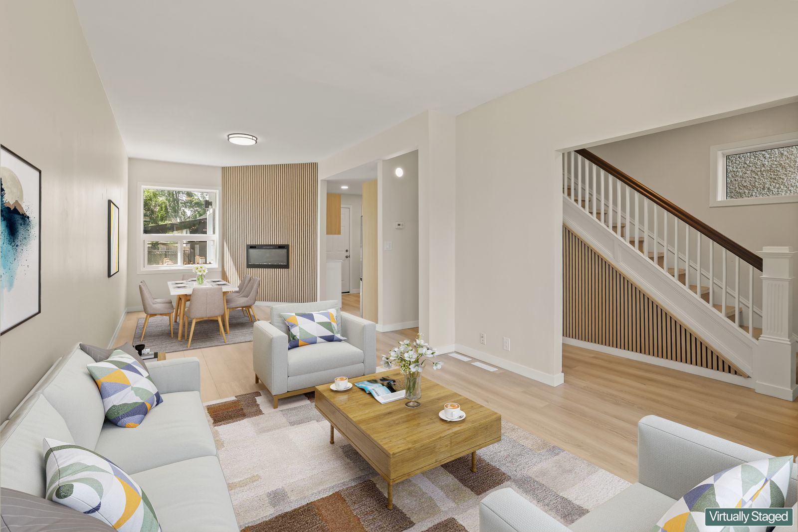 Living room looking toward the staircase, virtually staged