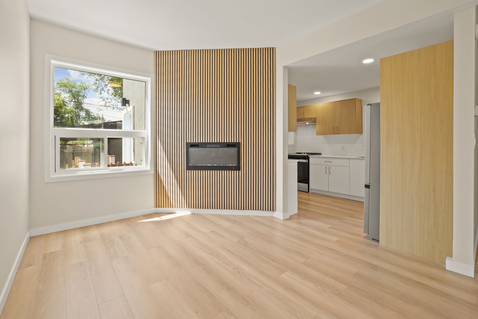White oak slat feature wall with linear fireplace