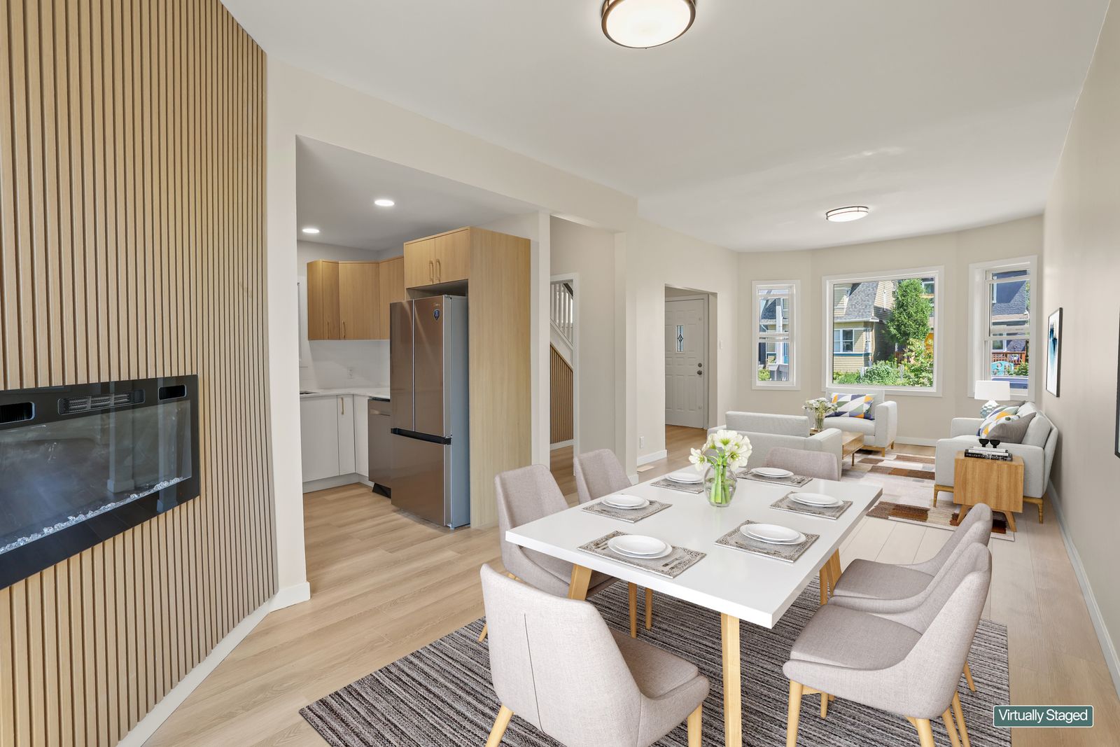 Dining area open to the kitchen, virtually staged